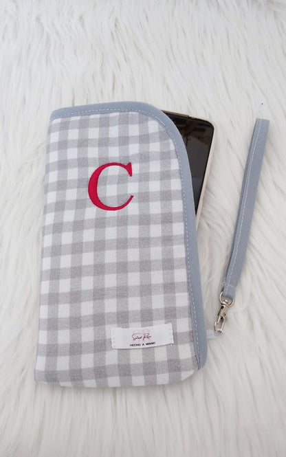 Funda de móvil acolchada con bolsillos interiores